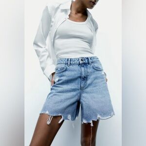 Distressed denim shorts